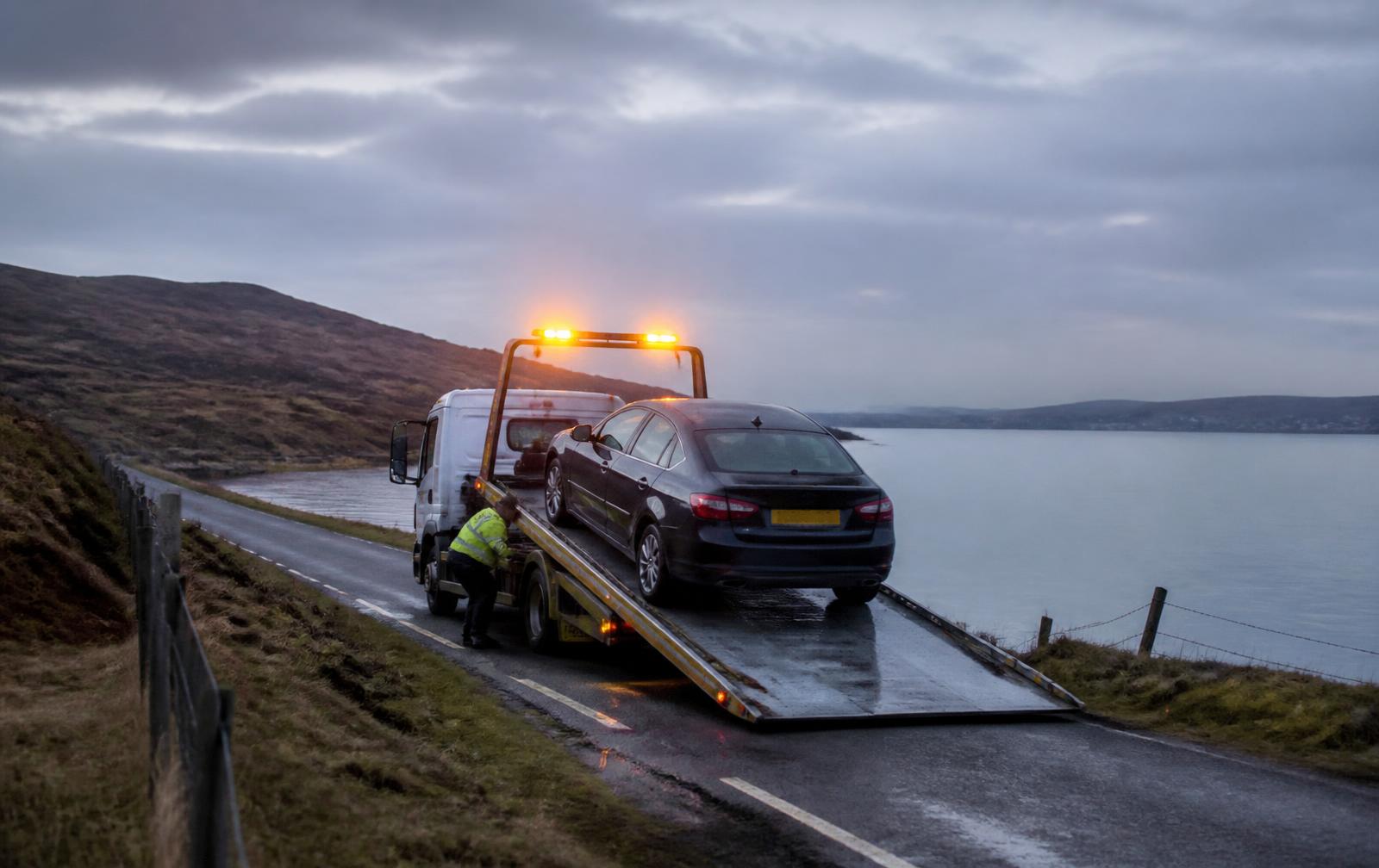 Recovery truck loading a car at the roadside near Peterhead